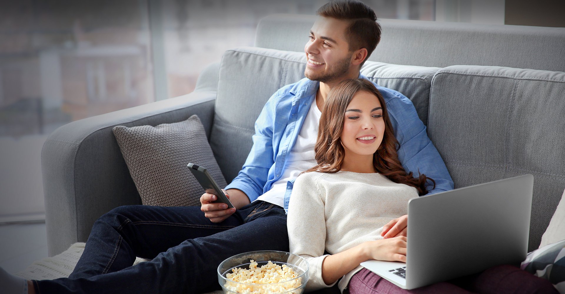 A couple enjoying television and movies at home